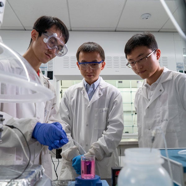 haotian wang in lab with graduate students