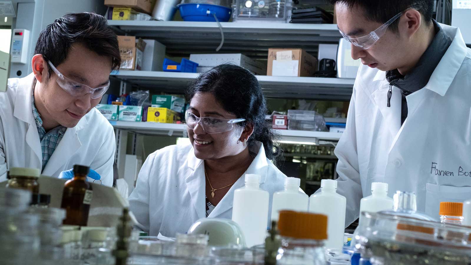 From left, Rice University graduate student Quan Anh Nguyen, postdoctoral fellow Anulekha Haridas and graduate student Botao Farren Song construct full-cell batteries with high-capacity silicon anodes and high-voltage nickel manganese cobalt oxide cathodes coated with protective alumina.