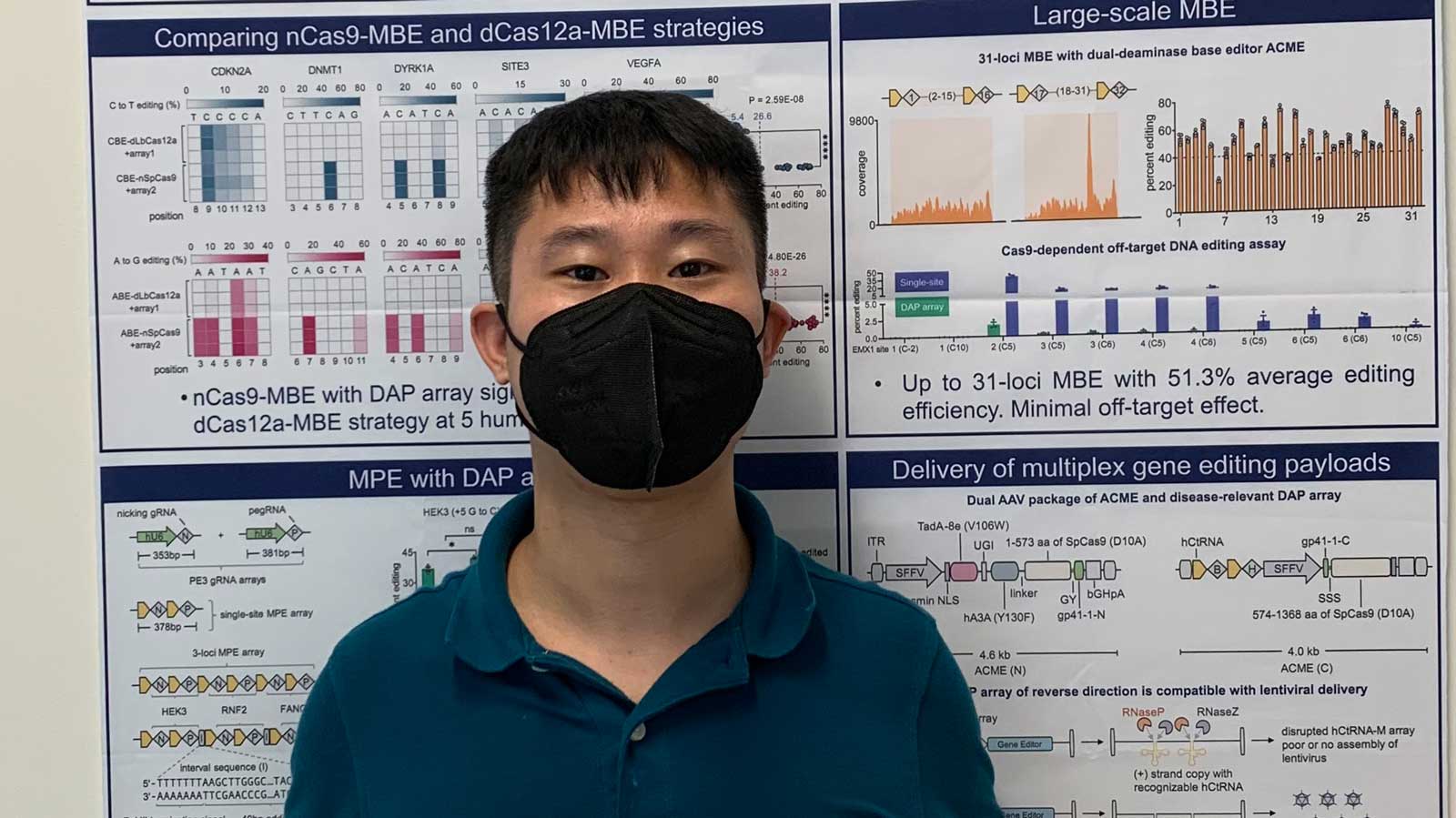 Qichen Yuan standing in front of poster