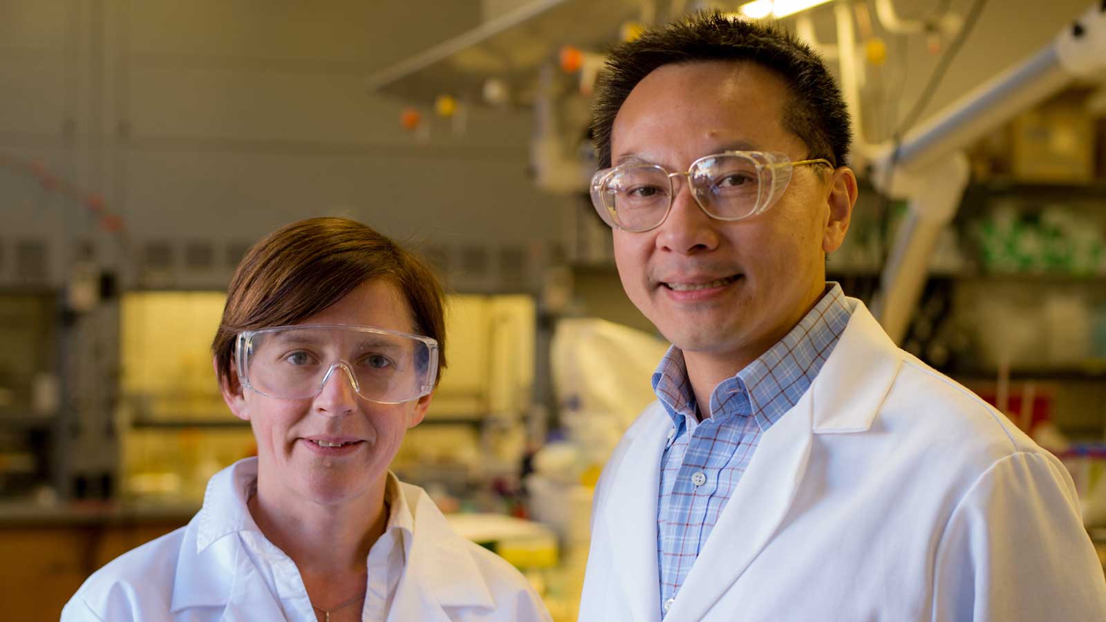 Kimberly Heck and Michael Wong in a lab